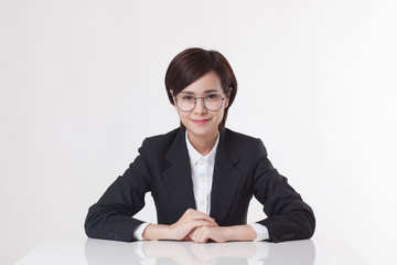 Young Asian short hair female model in formal dress which is good for business purpose