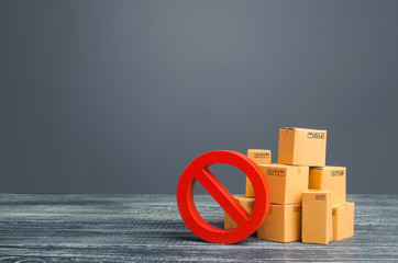 Cardboard boxes and red prohibition symbol NO. Out of stock. Embargo trade wars. Overproduction or scarcity. Restriction on import, ban on export of dual-use goods to countries under sanctions. - obrazy, fototapety, plakaty
