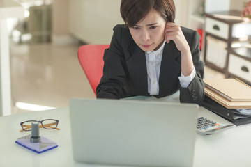 Young Asian short hair female model in formal dress which is good for business purpose