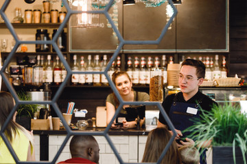 Garson accepts an order.