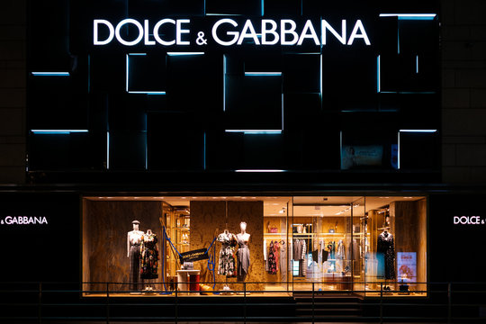 Dolce & Gabbana store, shopping window and logo signage at night in Hongkong - November, 2019