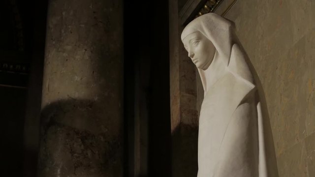 Saint woman statue catholic Rita of Cascia by Erno Jalics St. Stephen's Basilica in Budapest Hungary closeup handheld shot