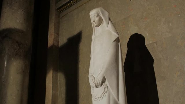 Saint catholic woman statue Rita of Cascia by Erno Jalics St. Stephen's Basilica in Budapest Hungary gimbal smooth camera movement