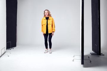 Fototapeta premium Female Model Working On Set In Photographic Or Film Studio