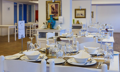interior of traditional Greek restaurant with wooden white furniture, in bright colors, resort hotel, Rhodes, Greece, Europe