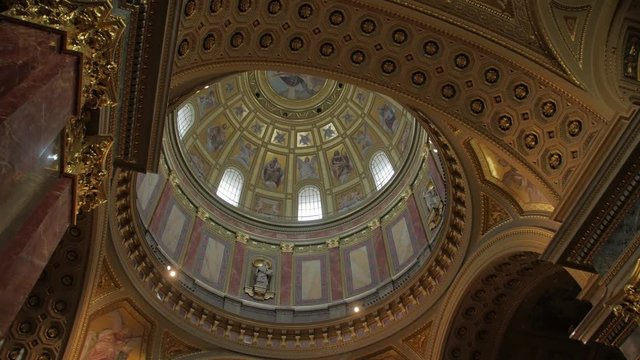 The temple interior dome vaults of Catholic temple St. Stephen's Basilica in Budapest Hungary church gimbal smooth camera movement