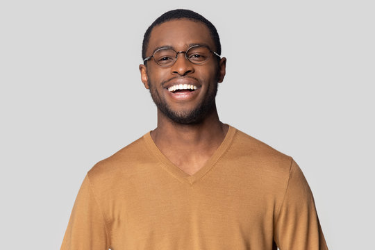 Happy smiling african american man in casual sweater portrait.