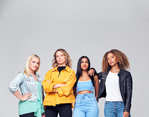 Obraz premium Studio Shot Of Young Independent Multi-Cultural Female Friends Looking Into Camera