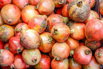 A bunch of whole ripe pomegranates.