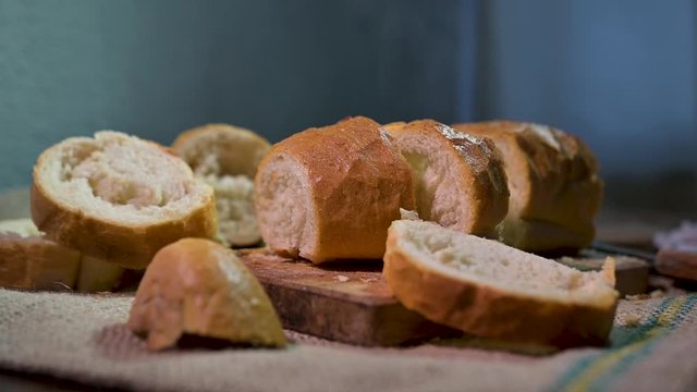 hot home made bread on cutting board cut on slices
