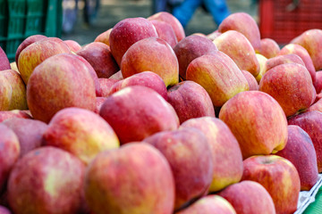 A bunch of whole ripe apple in fruit market 