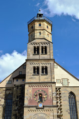Fototapeta na wymiar Old German Stone Church Tower with Decorated Clock Tower