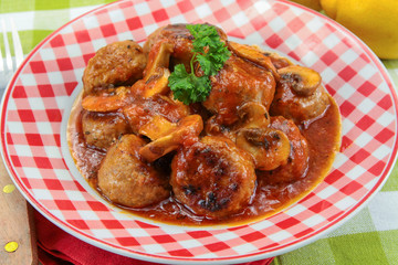 meatballs with tomato sauce on a plate