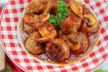 meatballs with tomato sauce on a plate