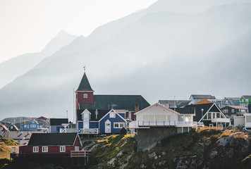 Colourful little Arctic town Sisimiut in Greenland,Qeqqata Municipality, aka Holsteinsborg . Second largest city in Greenland. Overview of port area and Sisimiut Museum, a collection of historic © Mathias