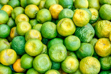 Fresh Green orange bunch in fruit stall 