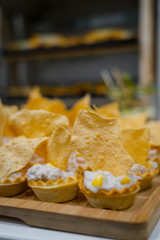 Tartlet puff pastry with cream cheese, corn and crispy parmesan.