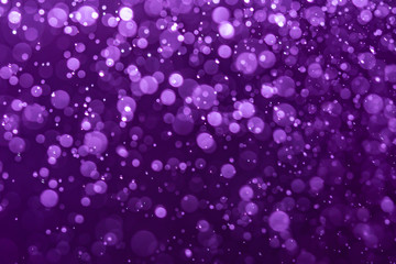 Abstract Purple bokeh defocus glitter blur background.