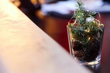 Christmas decoration from a Christmas tree, cones and lights