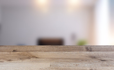 Empty interior with large window. Retro light bulb. The floor is of brown parquet.  3D rendering. wooden table. blurred background