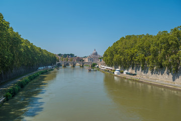 The Tiber River, the Sant'Angelo Bridge and the dome of St. Peter's Basilica in Rome, Italy