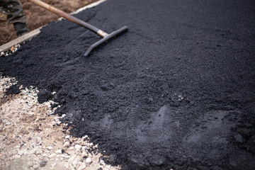 Park track repair. Paving the road in the forest.