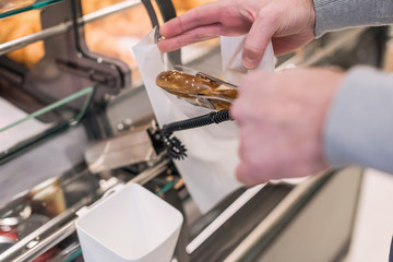Man buying pretzels in a pastry shop for Christmas