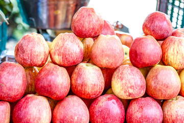 A bunch of whole ripe apple in fruit market 
