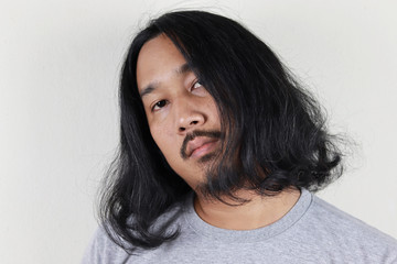 asian man with long hair and beard