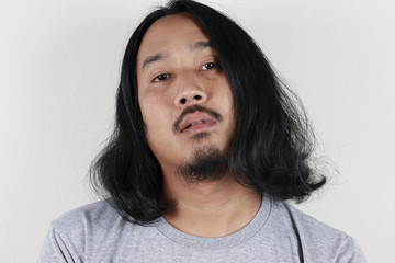 asian man with long hair and beard