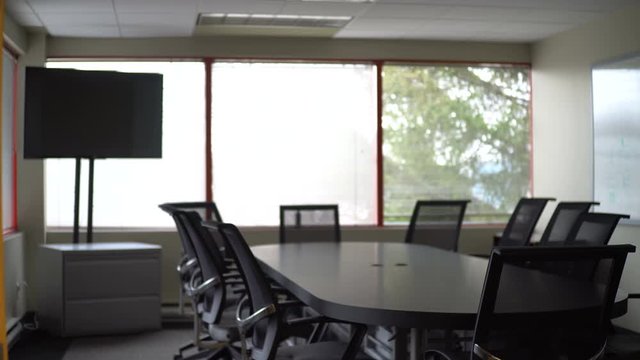 Smooth slider shot of an empty corporate boardroom