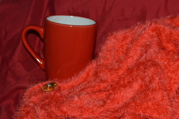 Red coffee cup and red background