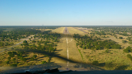 Approaching Maun international Airport surroundings in Botswana, airstrip in the distance