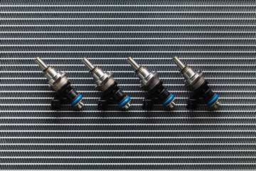 Auto Parts - four fuel nozzles of the injector for the combustion chamber of the engine lie against...
