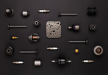 Studio photography - a lot of automotive parts: valves, spark plugs, silent blocks, thermostats,...