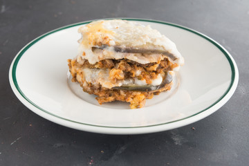 Moussaka, eggplant of aubergine. Top view in black background