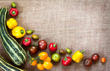 Assortment of colorful fresh vegetables on sackcloth background