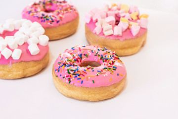 Colorful donuts on the table. close up view. copy space