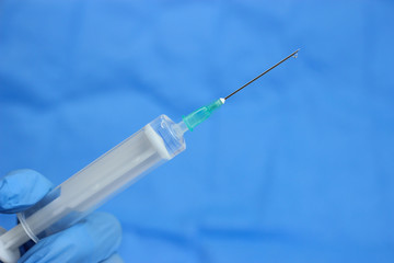 Gloves and syringe isolated on white. Healthcare And Medical concept.