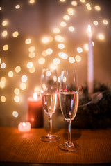 Christmas champagne on a table against the background of garlands