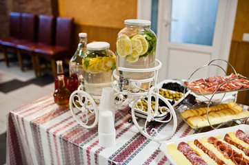 Dessert table of delicious snacks on wedding reception.