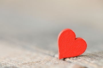 A red heart with a blurred background. High resolution photo.