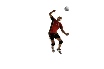 Young caucasian volleyball player placticing isolated on white background. Male sportsman training...