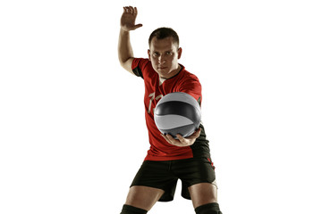 Young caucasian volleyball player placticing isolated on white background. Male sportsman training...