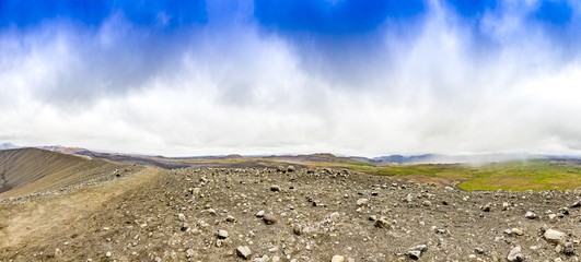Panoramic picture over colorful Hverir geothermal area from Hverfjall volcano crater on Iceland in...