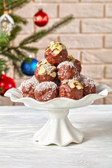 Chocolate Coconut Almond Balls on a cake stand