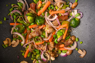 Wok, close-up, shredding meat with vegetables.Tasty food, culinary background, gastronomy