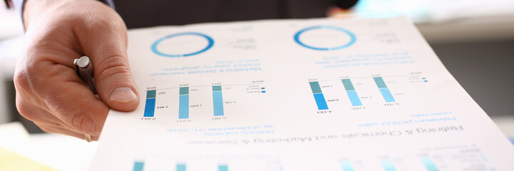Fototapeta premium Auditor Calculating Tax Income Using Business Data