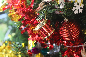 close up of christmas ball and pine tree background (celebration concept)