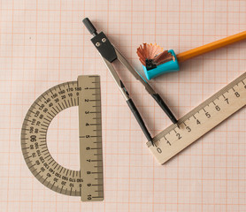 Geometry set with compass,pencil,ruler on graph paper